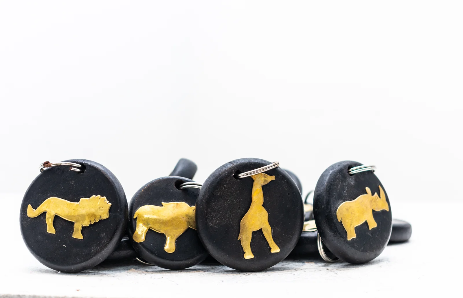 Wood and brass Kenyan animal keyrings